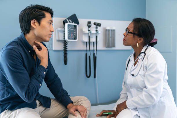 istock Korean man in consultation with doctor 1174321895