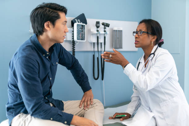 istock Korean man in consultation with doctor 1174321896