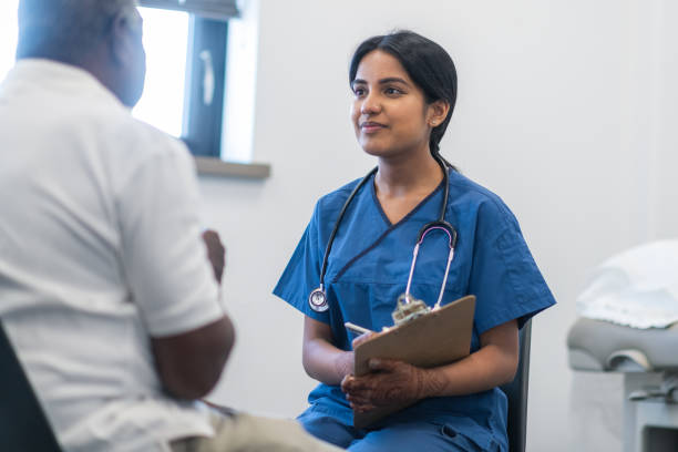 istock Kind Indian doctor meets with elderly patient 1174322663