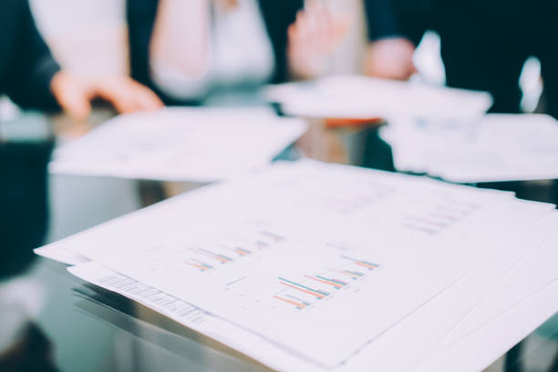 Marketing analysis. Cropped shot of professional team working on project. Closeup of graphs charts.
