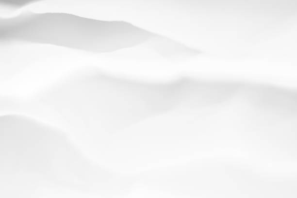 istock white paper layers blur snow hills background 1174322709