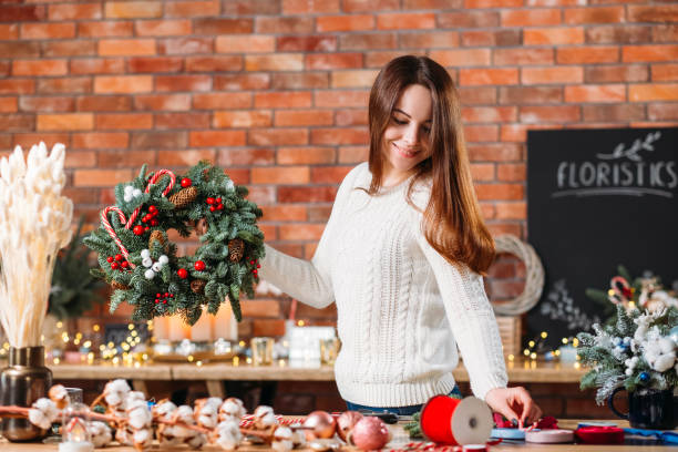 istock florist craft studio creative lady fir tree wreath 1174322733