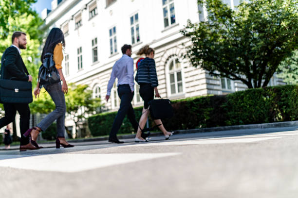 istock Business people walking on pedestrian crossing 1174323082