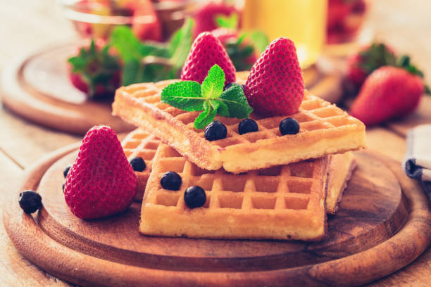 istock Fresh waffles with strawberry and chokeberry 1174326133