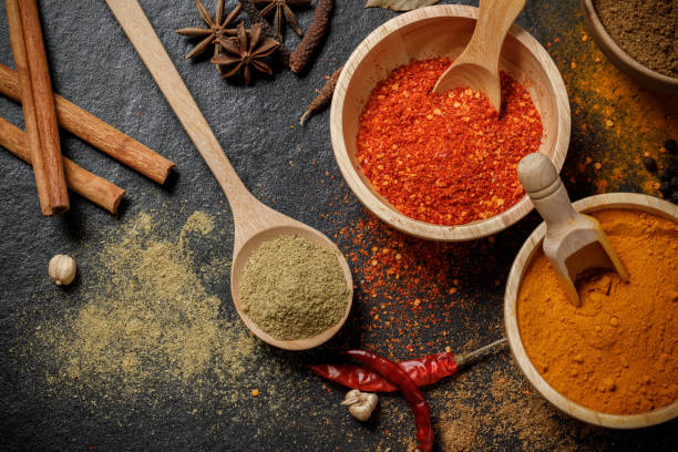 istock Herbs and spices over black stone background. Top view 1174336320