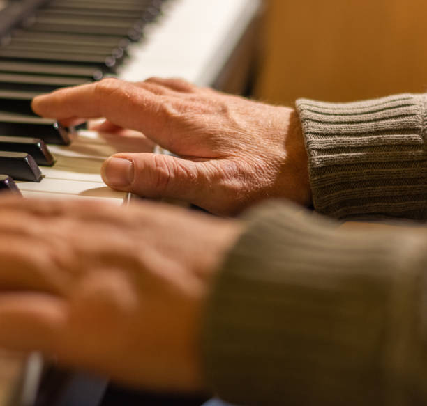 istock Playing Piano. Pianist with Hands on Keys Close-up. 1174336405