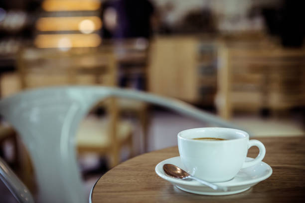 istock Cup of coffee on table in cafe - vintage style effect picture 1174336441
