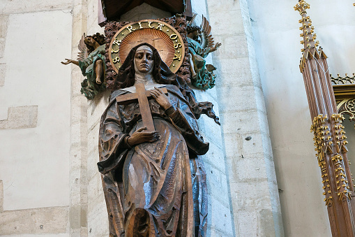 Krakow, Poland - May 27, 2016: Wooden sculptere of the Saint Rita of Cascia in roman catholic Church of St. Catherine of Alexandria and St. Margaret. The church is situated in the Kazimierz district.