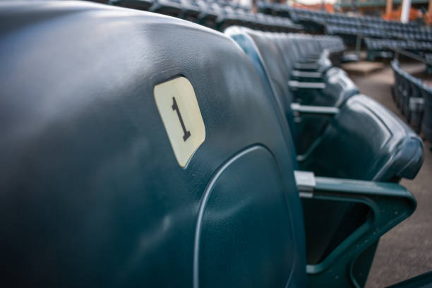 istock Green Stadium Seats Closeup 1174338526