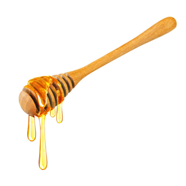 istock Honey dripping isolated on a white background, Dripped honey, Honey dipper 1174338947