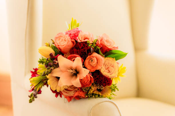 Shot of flowers on a chair before a wedding ceremony