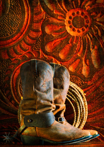 istock Old Cowboy Boots And Lasso 1174339982