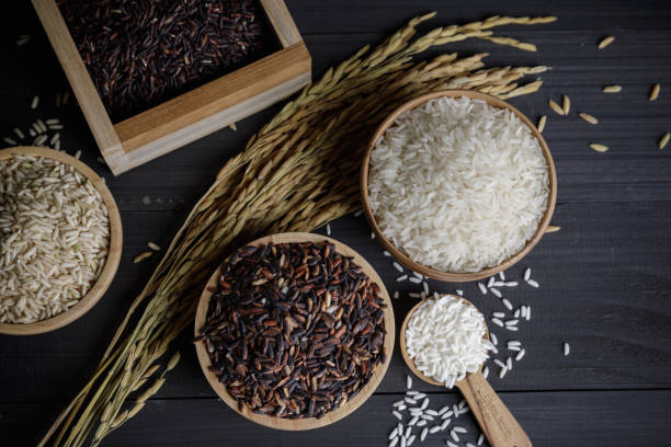 istock Japan rice with Thai jasmine rice and paddy rice seed on wooden table 1174340047