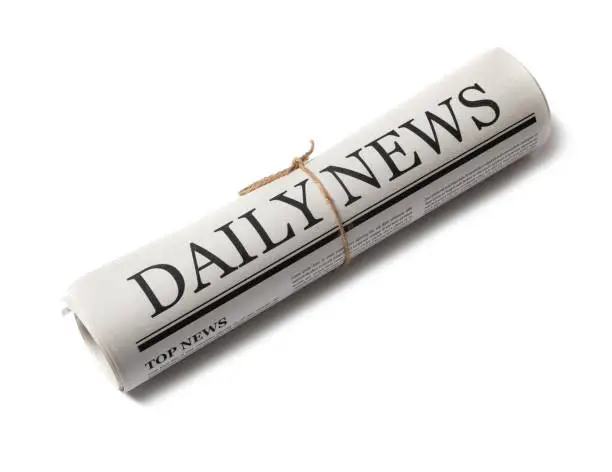 Photo of Rolled Business Newspaper with the headline News isolated on white background, Daily Newspaper mock-up concept