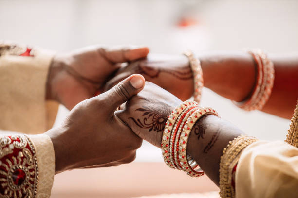 When two hearts became one Cropped shot of an unrecognizable young couple holding hands on their wedding day hinduism stock pictures, royalty-free photos & images