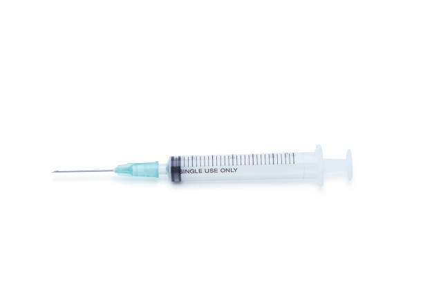 istock Blank plastic syringe with injection needle isolated on white background 1174345584