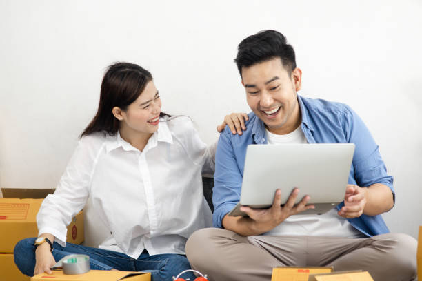 istock Asian couple with stack of parcel boxes, online business and delivery concept. 1174347645