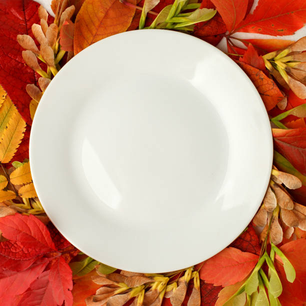istock Autumn composition concept background. Autumn bright leaves. Flatlay background, Thanksgiving table, empty plate, seasonal concept menu of cafe, restaurant 1174348909