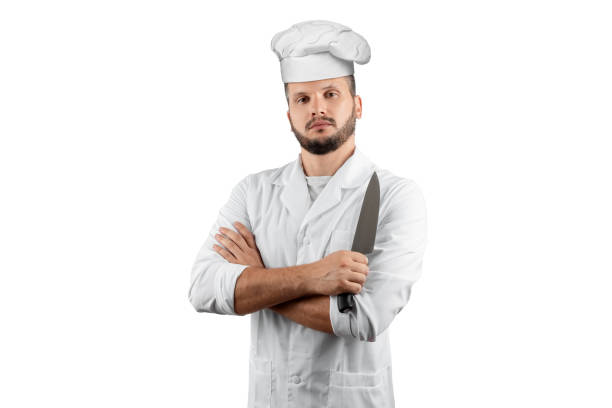istock A man with a beard, a cook in a hat and a knife in his hand Isolated on a white background. Cooking, recipes, cuisine. 1174354552