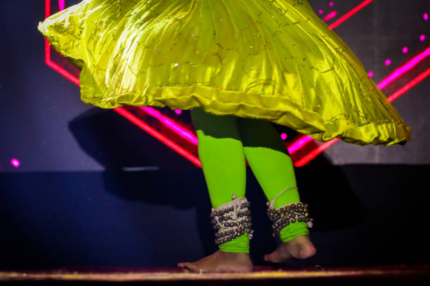 indian classical dance form in feet with musical anklet with selective focus and blur