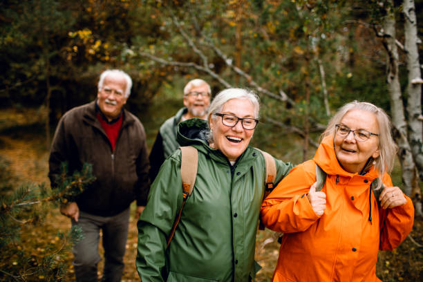 istock Seniors hiking through the foerst 1174356871
