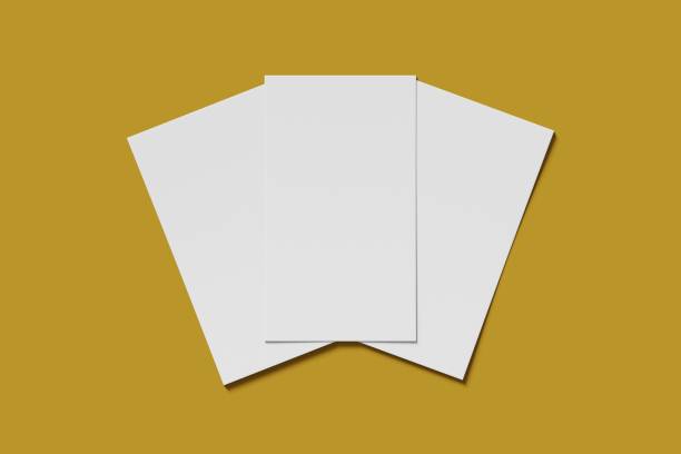 istock Three Mockup blank business or name card on a yellow background. 3D rendering 1174363825