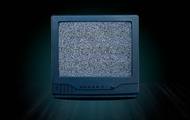 istock vintage old television receiver on table front gradient green wall background,vintage tv with cut screen on perspective wooden floor,blue glow and dark tone style 1174364002