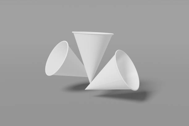 istock Set of three white paper mockup cups cone shaped fly on a grey background. 3D rendering 1174364971