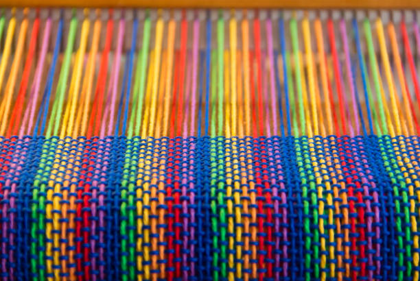 istock Comb loom with rainbow colors and diversity flag 1174365234