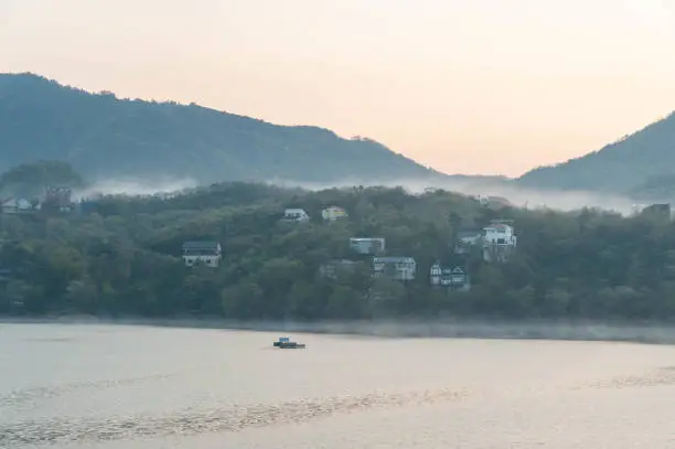 Lake and villa surrounded by morning glory