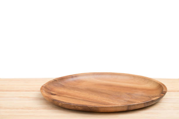istock Perspective empty wooden tray and table with white background including clipping path for product display montage or design layout. 1174366028