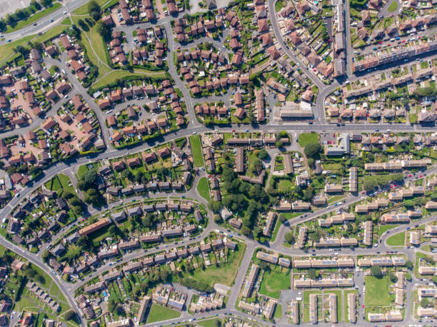 Aerial photo of the British town of Middleton in Leeds West Yorkshire showing typical suburban housing estates with rows of houses, taken on a bright sunny day using a drone. stock photo