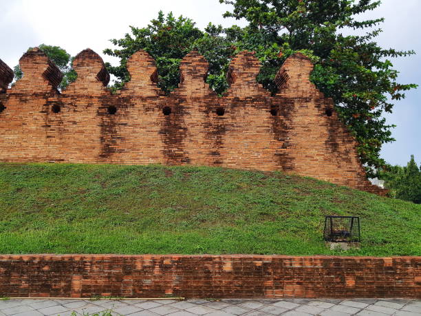 istock old city wall brick grass sky and tree 1174370980