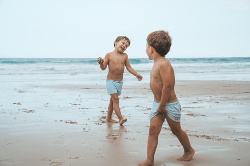 Boys playing at the beach