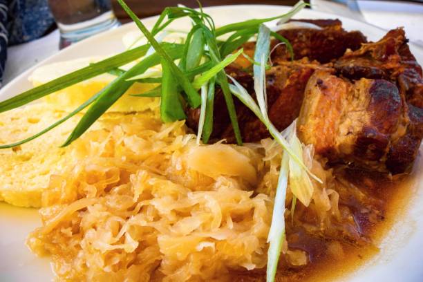 istock Stewed cabbage, roasted pork meat and dumplings. 1174373061