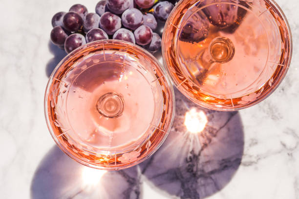 istock Two crystal stemmed glasses with rose wine 1174374153