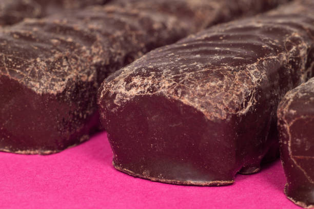istock Chocolate candies on a pink background, macro, sweet 1174374279