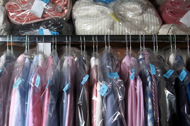 shirts on the hanger shirts and duvets in the dry cleaner dry cleaner stock pictures, royalty-free photos & images