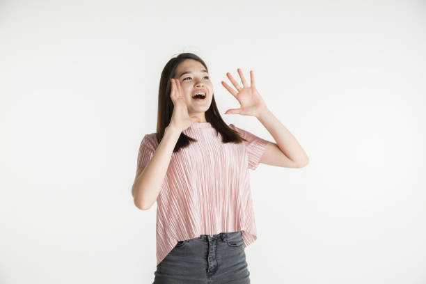 istock Beautiful girl's half-length portrait on white studio background 1174376389
