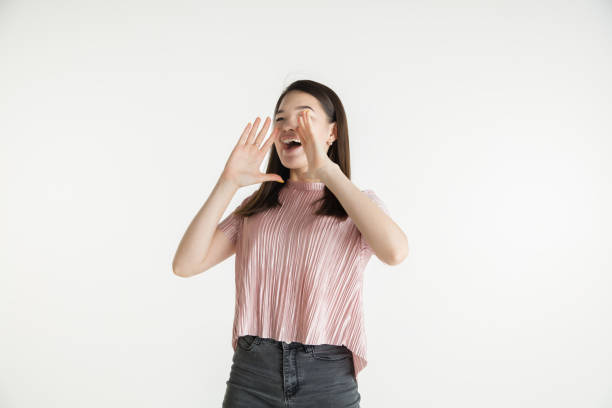 istock Beautiful girl's half-length portrait on white studio background 1174376391