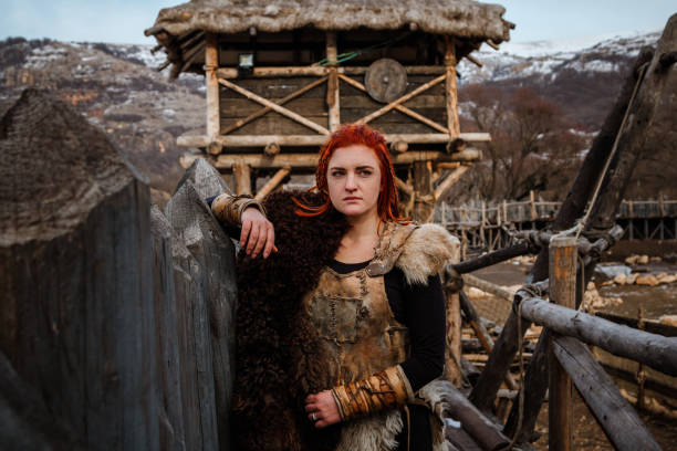 istock Viking woman in a traditional warrior clothes. 1174377907