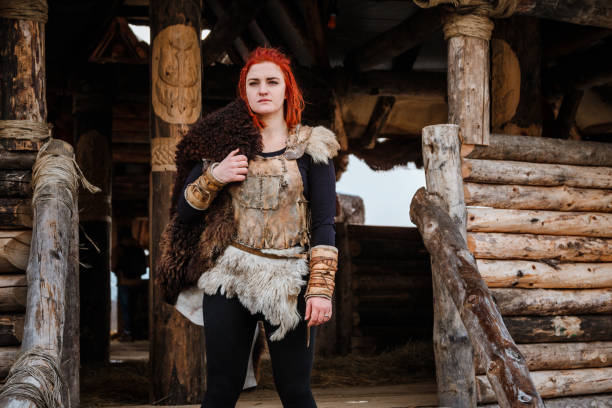 istock Viking woman in a traditional warrior clothes. 1174377947