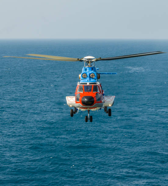 istock helicopter flying over the sea 1174381607