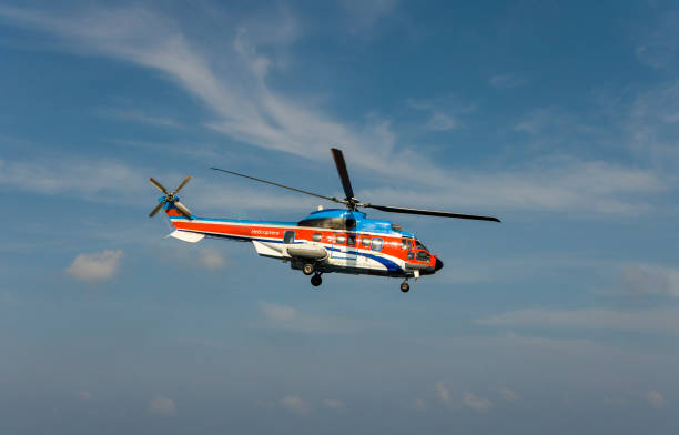 istock helicopter flying over the sea 1174381794