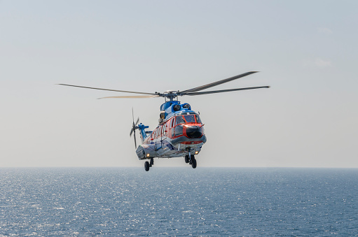 helicopter flying over the sea