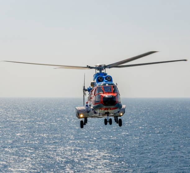 istock helicopter flying over the sea 1174381979