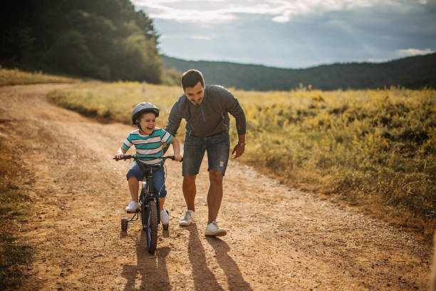 istock Father and son spending time in nature 1174382130