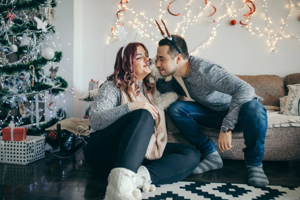 istock Millennial couple playing with cute dog 1174384323