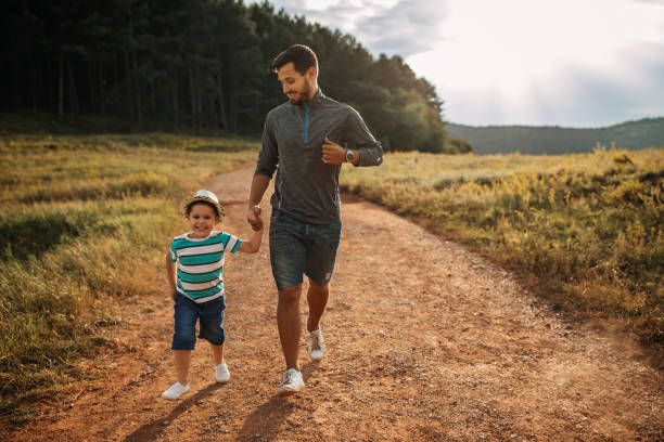 istock Father and son spending time in nature 1174384625