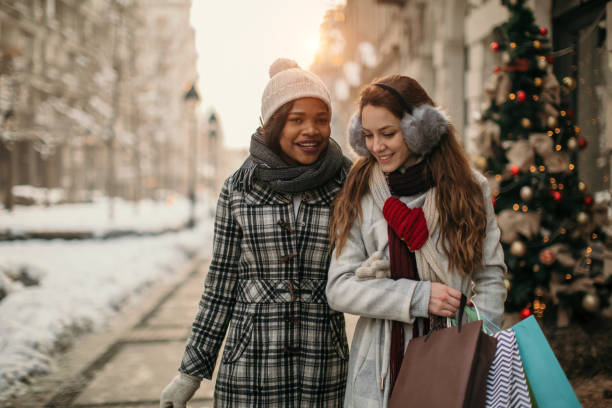 istock Two young women shopping for Christmas 1174384763